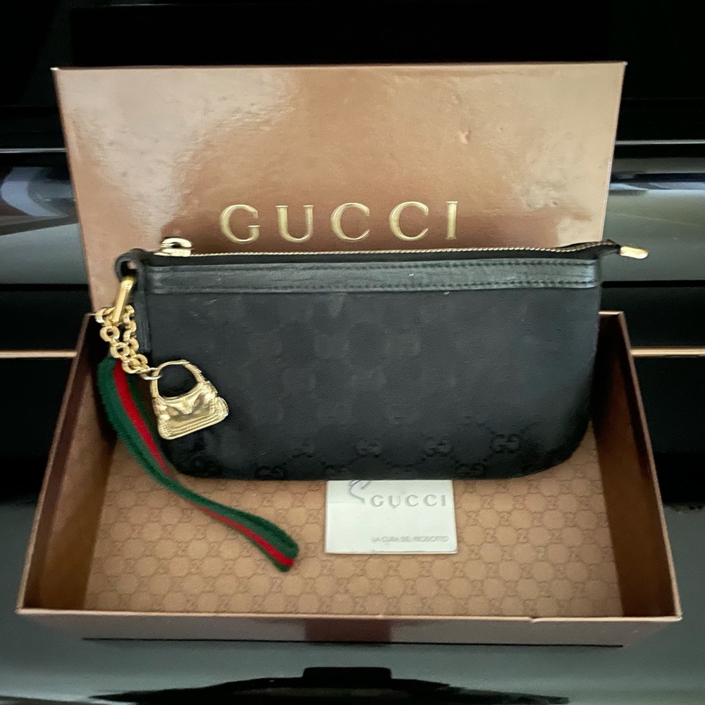 Authentic monogram Gucci GG wristlet pochette